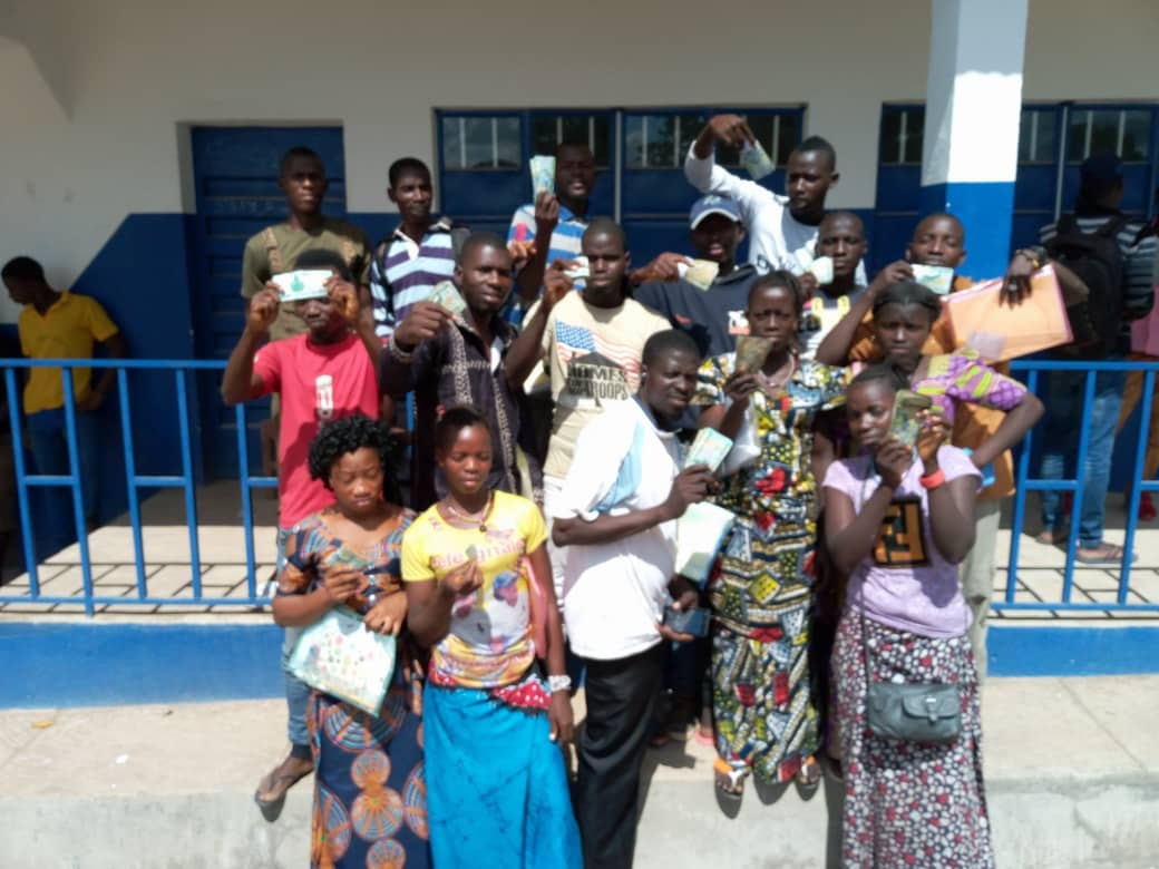 Community gathering at a school in Sierra Leone